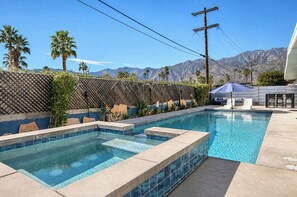 A swimming pool with a view of mountains, a pergola, and a covered seating area. - Sunny Dunes Oasis - Demuth Park (Palm Springs)