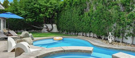 Dive into your private pool, soak in the bubbling hot tub, and unwind on the sun loungers surrounded by lush, mature trees and tranquil garden views.