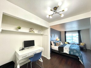 A modern bedroom with a desk, chair, bed, and a ceiling light fixture. - South San Francisco Sweet Home-10 minutes to SFO (South San Francisco)