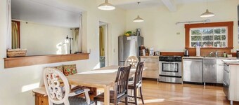Classic farmhouse-style home with front porch & amazing sunset views - walk to town
