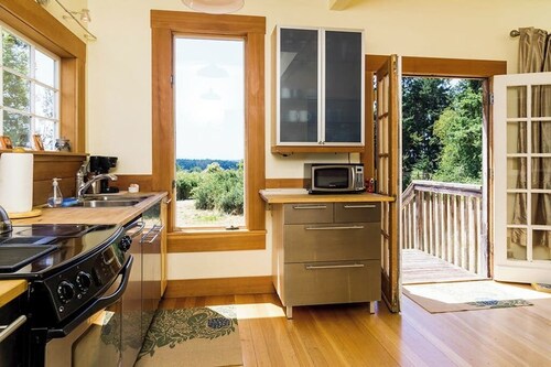 Classic farmhouse-style home with front porch & amazing sunset views - walk to town