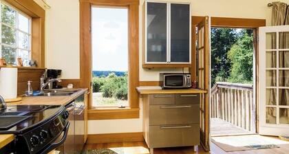 Classic farmhouse-style home with front porch & amazing sunset views - walk to town