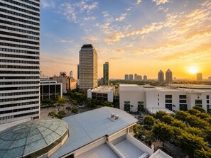 A cityscape with modern buildings, a clear sky, and a sunset. - Solana ONE By SanLiving - Senayan (Jakarta)