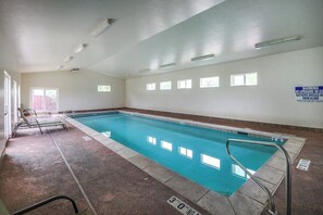 An indoor swimming pool with clear water, a lifeguard sign, and a 3-foot no diving zone. - Beautiful Dog-Friendly Home with Shared Indoor Pool, Yard, WiFi, and Fireplace (Moab)
