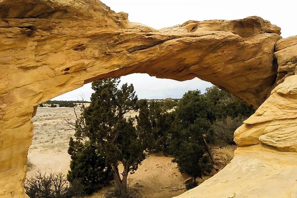 A natural rock formation with a clear archway.