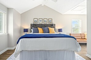 A bedroom with a bed, two bedside lamps, a headboard, and a window with blinds. - Auburn - 3 King Beds - 3 Private Baths - Near Downtown AU!! (Auburn)