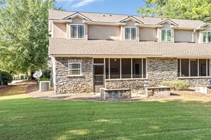 A two-story house with a stone facade, a covered porch, and a well-maintained lawn. - Auburn - 3 King Beds - 3 Private Baths - Near Downtown AU!! (Auburn)
