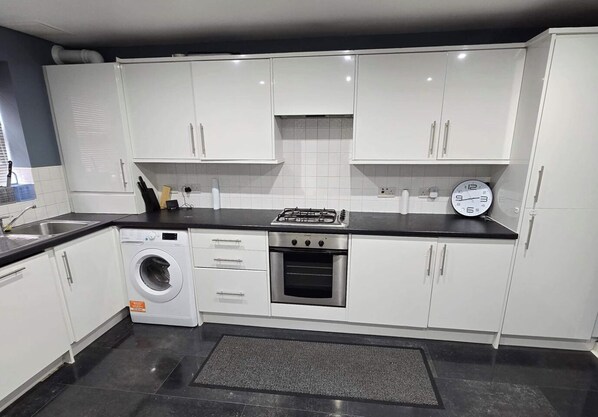 Bright big kitchen with double Ninja Airfryer and Microwave, dishwasher and washing Machine. Fridge freezer and a 2-seater dining chair