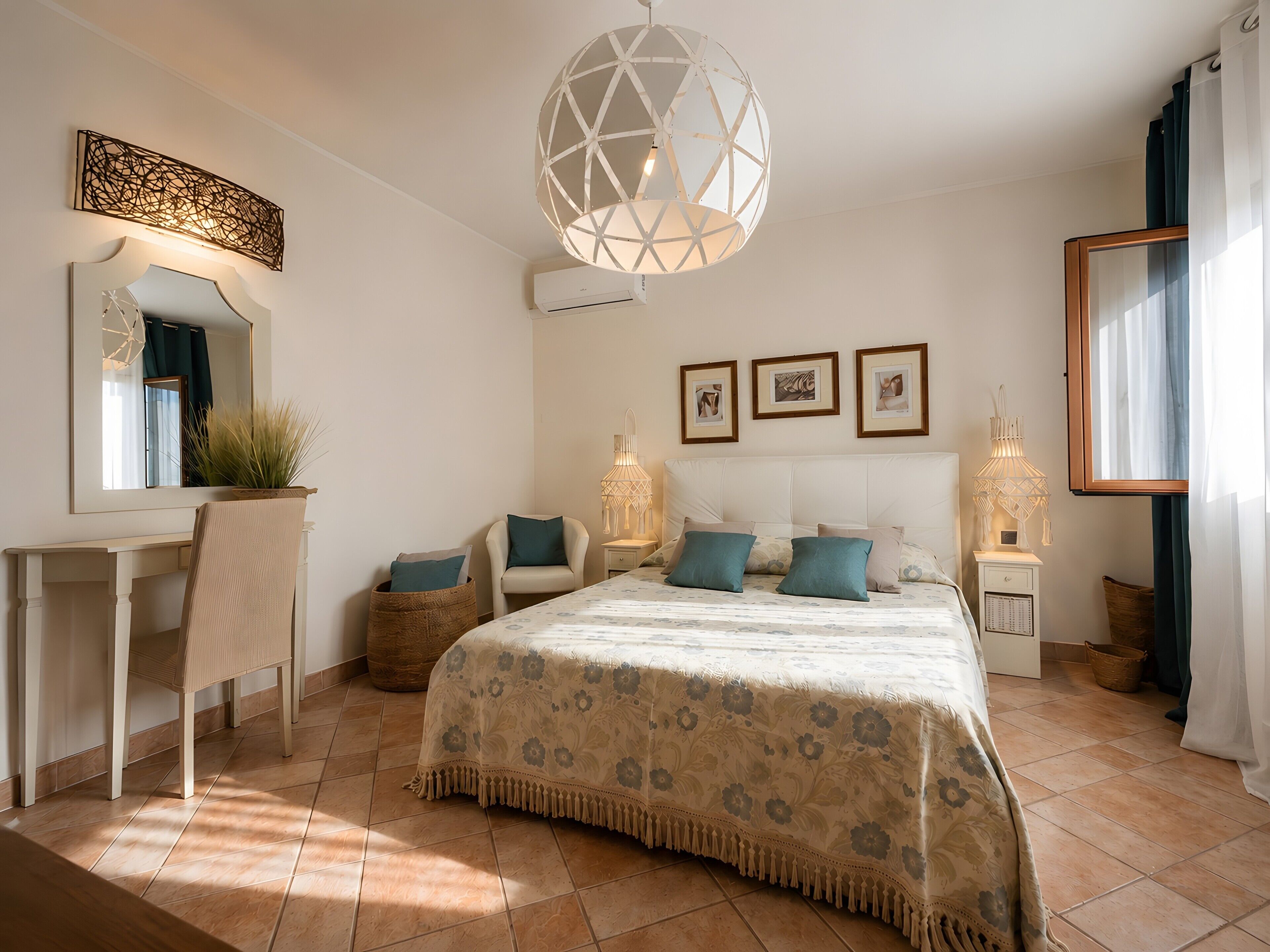 A bedroom with a bed, bedside lamps, a desk, and a mirror.