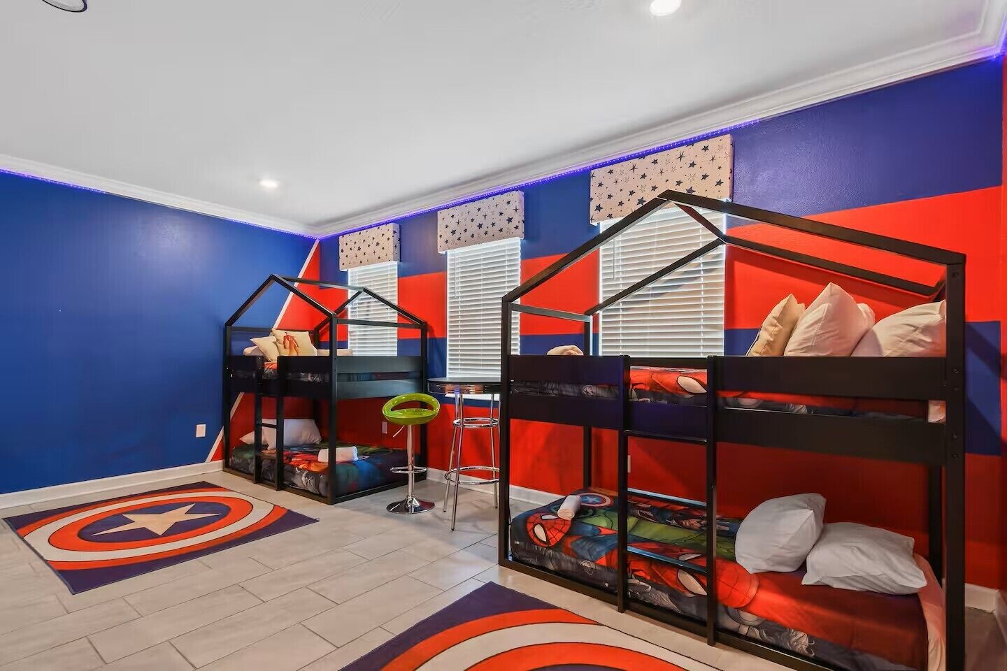 A children's room with bunk beds, a Star Wars-themed rug, and a Star Wars wall decal.