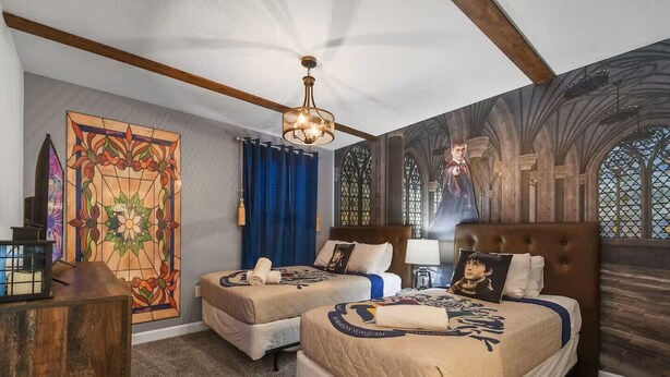 A hotel room with two beds, a stained glass window, and a gothic-style mural on the wall. - Storey Lake 8BR Family Adventure | Pool, Spa, Theater & Themed Rooms (Kissimmee)