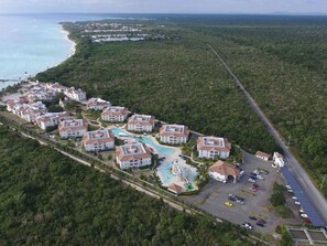 A resort with multiple buildings, a swimming pool, and a parking area. - Unknown Accommodation by Interhome (Bayahibe)