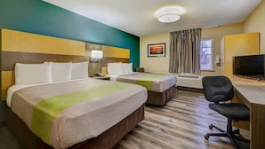 A hotel room with two beds, a desk with a chair, a television, and a window with curtains. - 3 Pet-friendly Units w/ Kitchenette | Near Town Center Plaza - 6.7 miles (Johnson County)