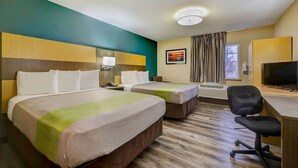A hotel room with two beds, a desk with a chair, a television, and a window with curtains. - Relaxing Extended Stay | 4 Units Near Nerman Museum of Contemporary Art - 2.9 mi (Johnson County)