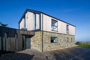 A modern two-story building with a stone facade and large windows. - Dune House - sleeps 8 guests  in 4 bedrooms (Hayle)