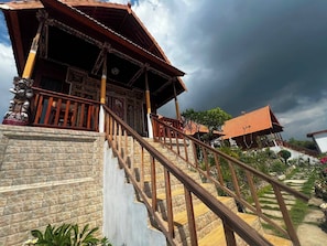 A traditional building with a staircase leading to a covered area. - Miyasabiasa Hills Nusa Penida (Klungkung)