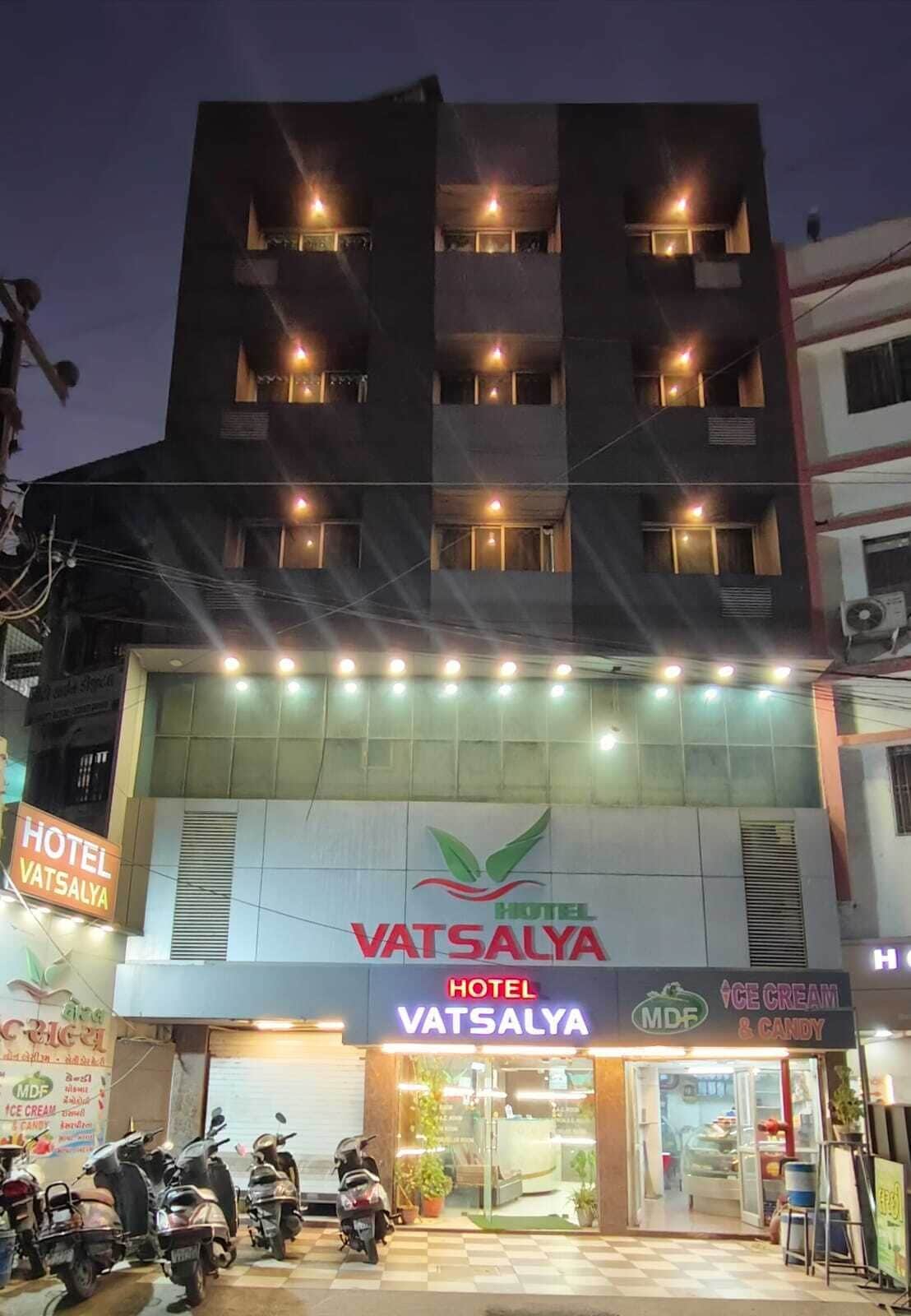 A hotel with a signboard for 'Hotel Vatsalya' and a visible entrance.