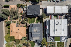 An aerial view of a residential area with multiple houses, some with visible rooftops and others with gardens. - Mountain & Lake Views! Unit 1 Mi to Empower Field (Denver)