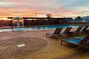 A pool area with lounge chairs and a water feature. - Extended Stay w/ Pool Access, Near Queen Creek (San Tan Valley)