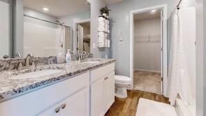 A bathroom with a double sink, a toilet, and a shower area. - Family Home w/ Game Room, Near Lake Hartwell! (Anderson)