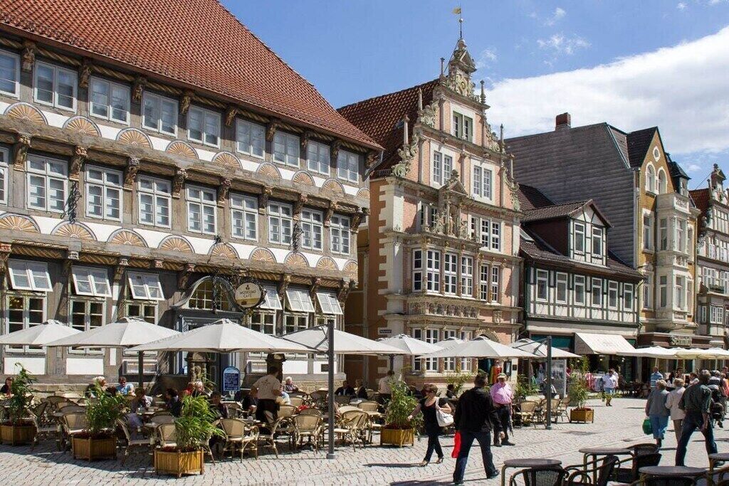 A historic building with a traditional European architectural style, featuring a tiled roof and ornate detailing.