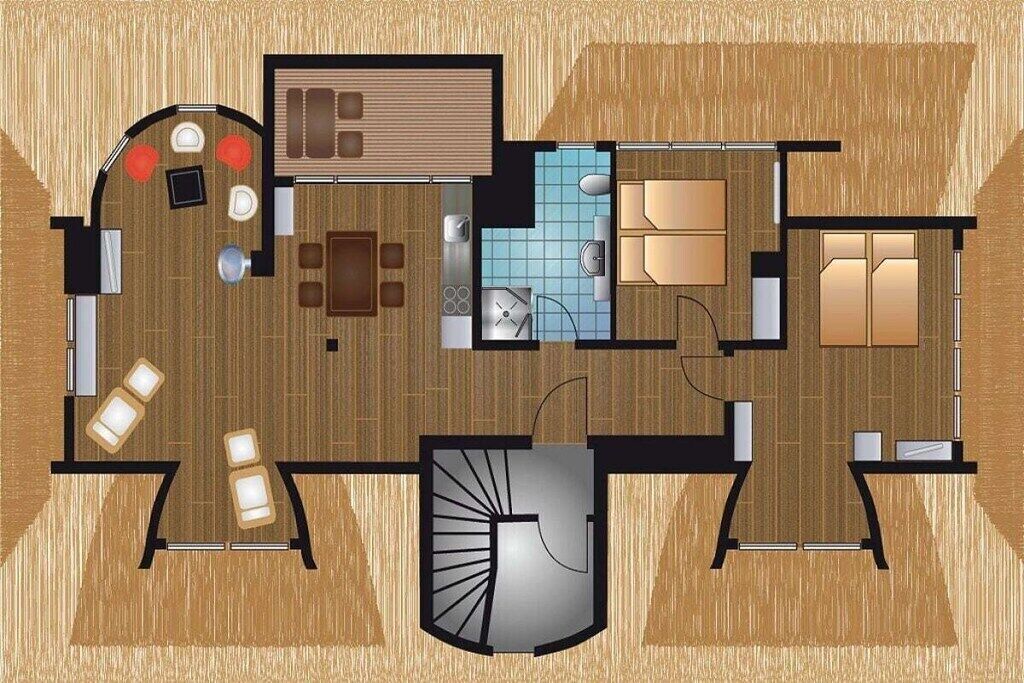 En hotelplans tegning, der viser et spiseområde, et køkken, en stue, et soveværelse og et badeværelse.