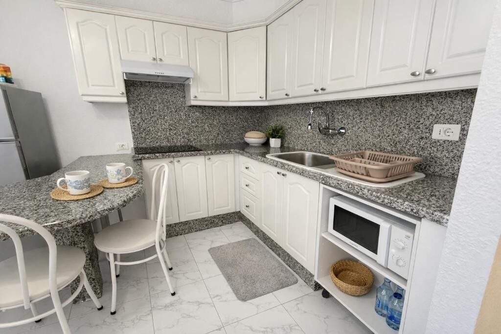 Apartment, Balcony, Pool View | Private kitchen | Electric kettle