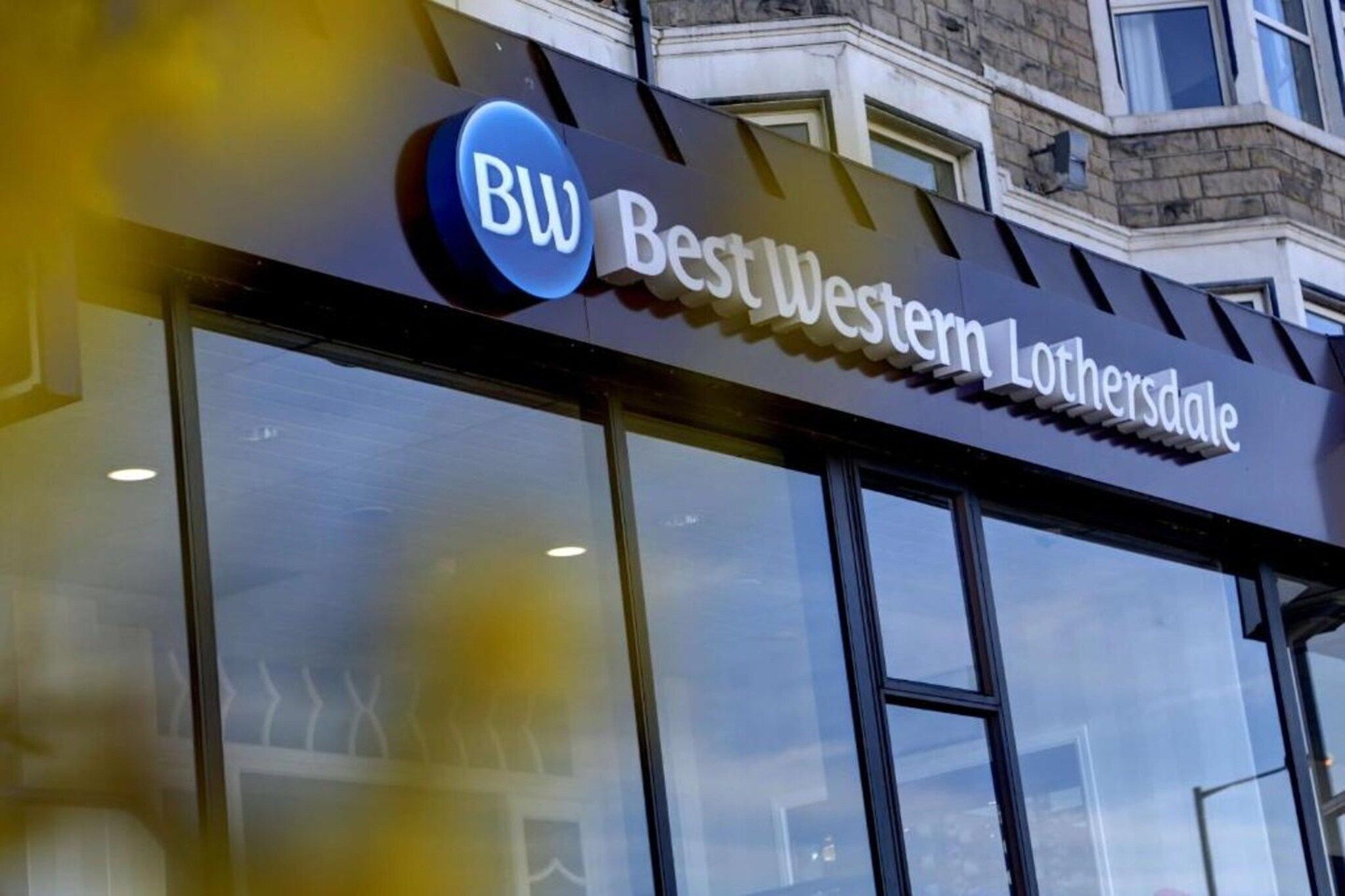 A storefront with a sign that reads 'BestWestern Lothersdale.'