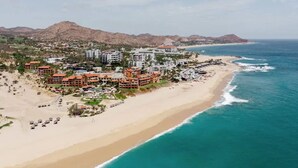 A coastal resort with beachfront villas, a pool area, and a view of the ocean. - Zoëtry Casa Del Mar Los Cabos One Bedroom Suite Ocean View (San José del Cabo)