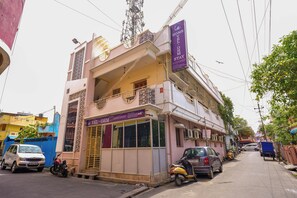A two-story building with a signboard for 'Home Vel-OHM Stay'. - Vel Ohm Homestay (Puducherry)