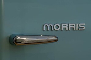 A vehicle's door handle and the word 'MORRIS' on the door. - Pop Urban Escape near the center (Athens)