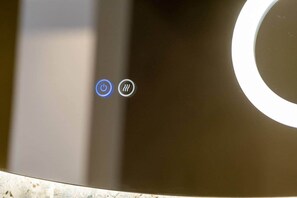 A control panel with a power button and a volume control. - Playful Design close to Athens Highlights (Athens)