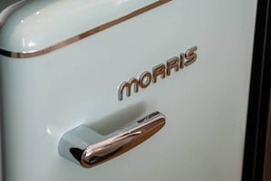 A close-up of a white object with the word 'MORRIS' and a metallic handle. - Tiny colorful studio near the Historic Center (Athens)