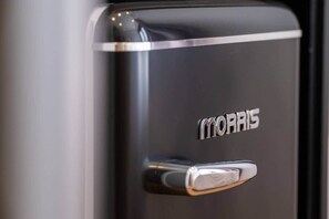 A black object with the word 'MORRIS' embossed on it. - Color Pop Studio with city Vibes near Center (Athens)