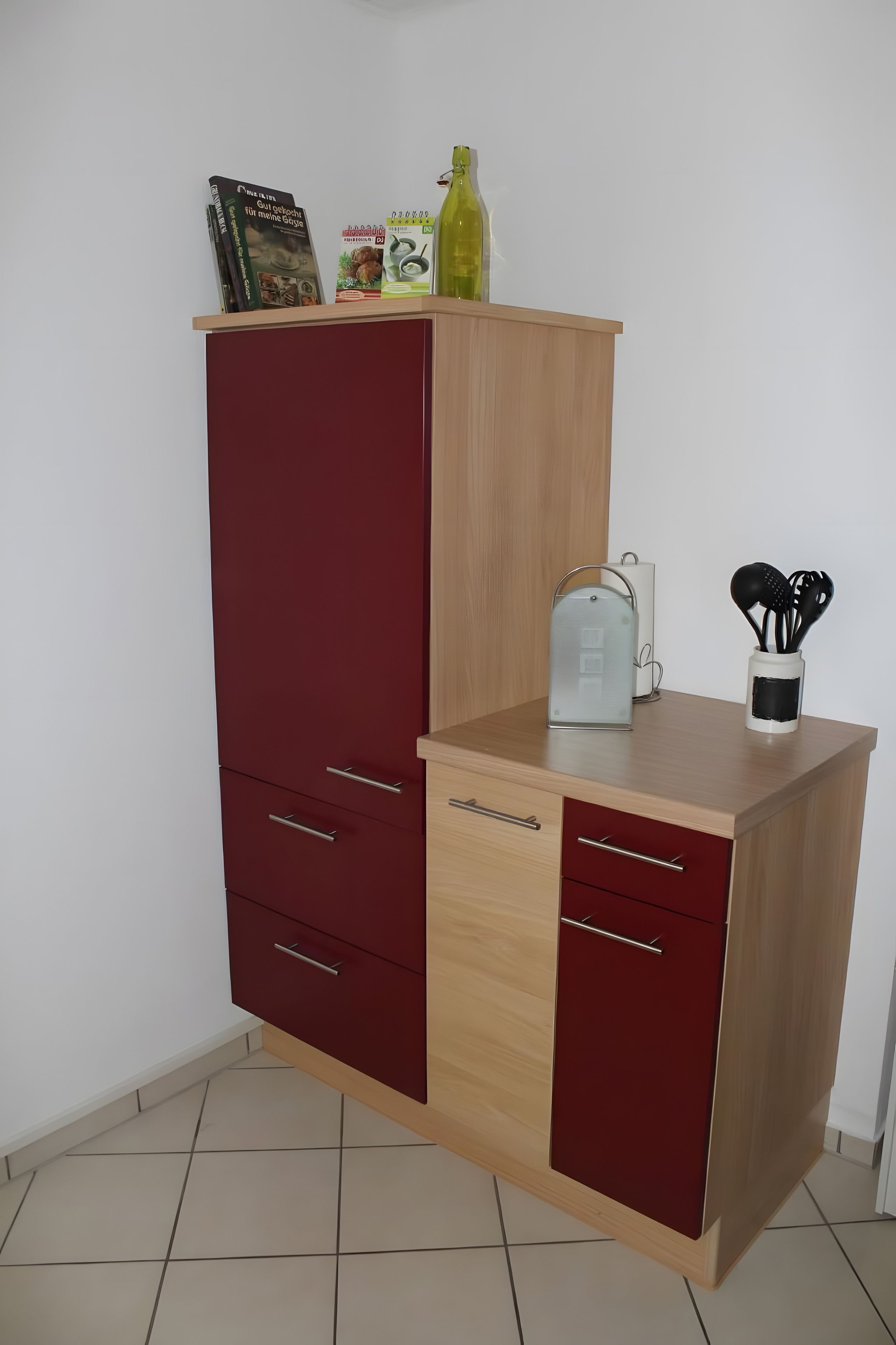A wooden cabinet with drawers and a countertop.