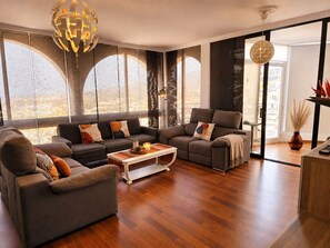 A modern living room with a sofa set, coffee table, and decorative items. - Ocean Dream House (Costa Adeje)