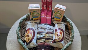 A basket containing various instant coffee products and a box of Nescafe 3 in 1.