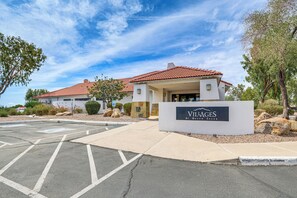 A building with a sign reading 'VILLAGES At Green Creek.' - Golf View, Pool Access! Updated Queen Creek Home (Queen Creek)