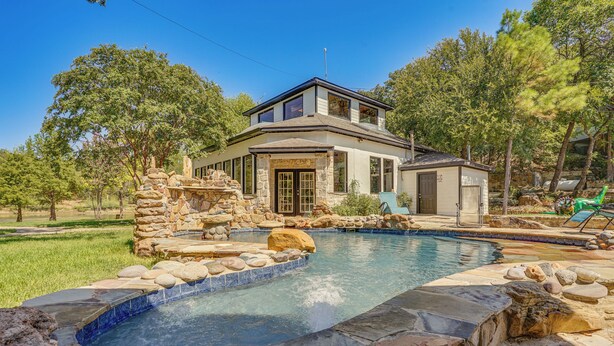 A two-story house with a stone pool and a stone patio. - Family Retreat Ready! 'castlewood Ranch' in Chico (Chico)