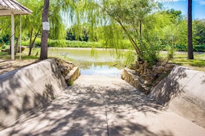 A concrete pathway leading to a pond with a sign prohibiting swimming. - Family Retreat Ready! 'castlewood Ranch' in Chico (Chico)