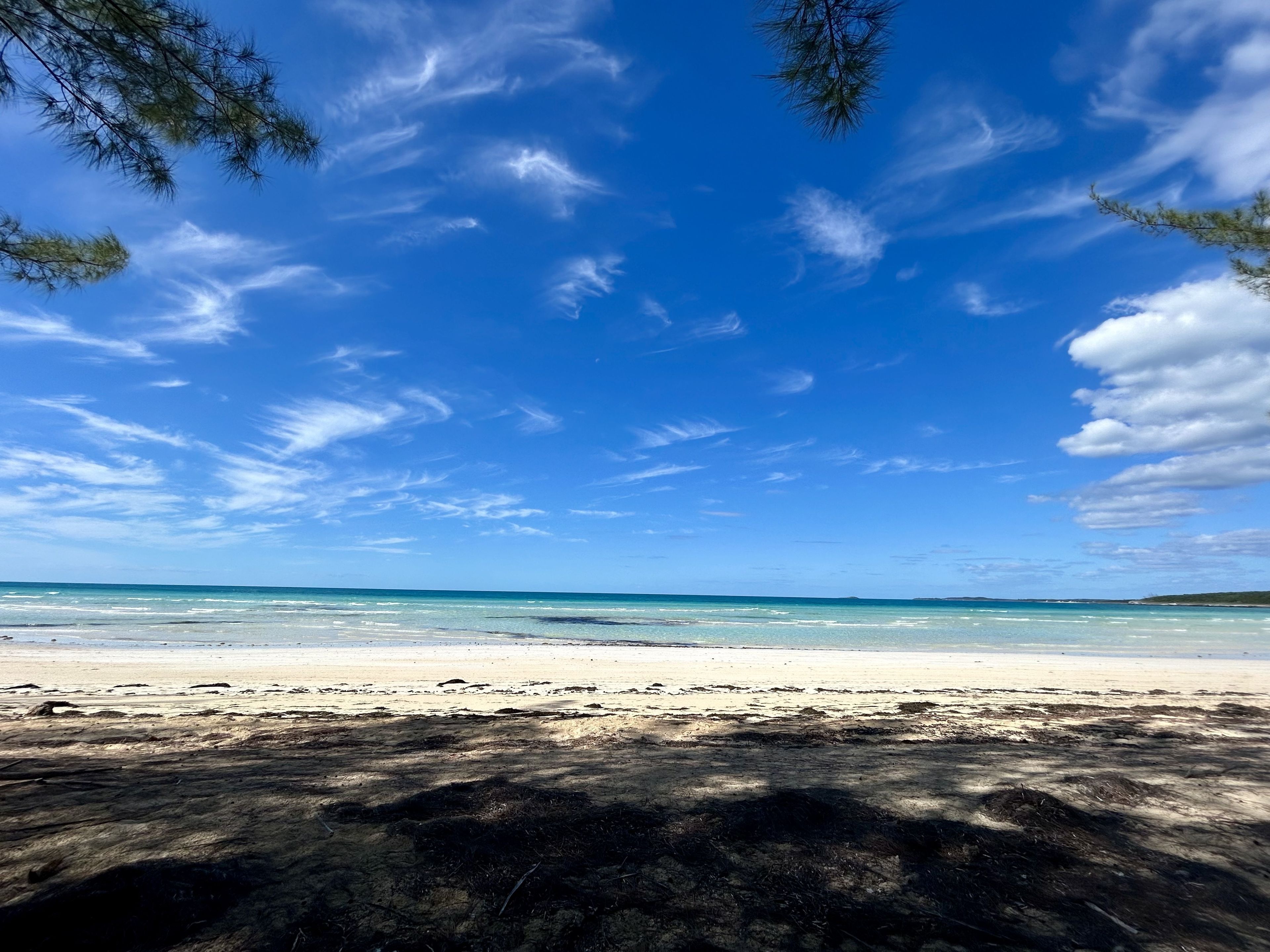 A beach with clear skies and calm waters.
