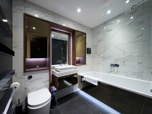 A modern bathroom with a glass-enclosed shower, a white sink, and a large mirror. - Sleek flat near the City 5 min from station - Pass the Keys (London)