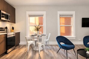 ☀️ Sun-drenched kitchen and dining area—bathed in natural light for effortless morning routines. - The Penn Hotel - Smart TV & King Bed Near Gaslamp! (San Diego)