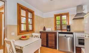 A compact kitchen with a dishwasher, a coffee maker, and a toaster. - Romantic Pollensa Country Escape (Pollensa / Pollença)