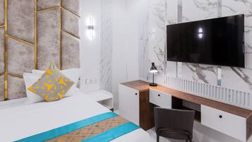 A modern hotel room with a bed, a desk, a chair, a television, and a marble wall.