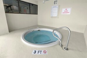 A small indoor pool with a 3 FT depth marker, a no glass containers sign, and a caution sign on the wall. - Luxury 2/2 Oceanfront at Sea Winds PH8 (North Myrtle Beach)