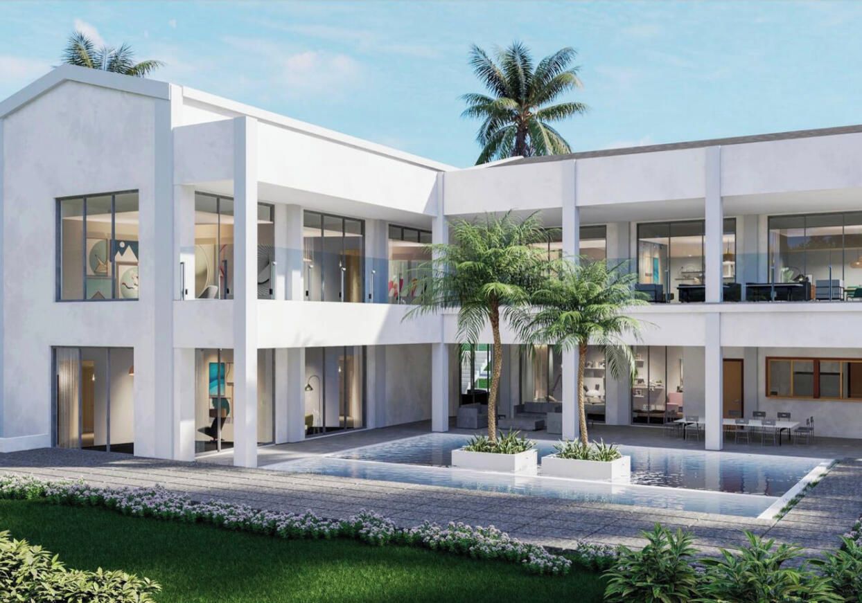 A modern building with a courtyard, large windows, and indoor seating areas.