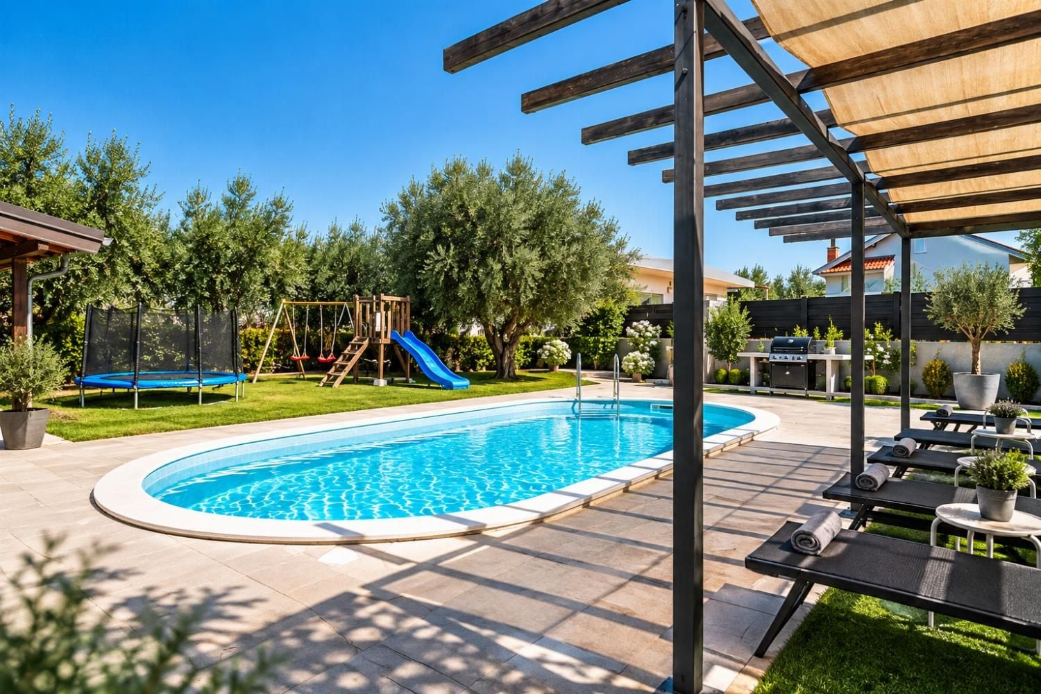 Private swimming pool with sun loungers, pergola shade, mature trees, and a relaxing landscaped garden.