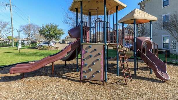 A playground with slides and climbing structures. - Landing Chic 1bd, Clubhouse, Gym (Katy)
