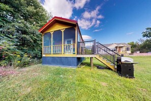 A house with a deck, a staircase, and a large window. - 1BR houses near lake with firepit, decks, withD, AC (Hector)